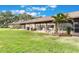A well-maintained backyard with lush green grass, sliding glass doors, and inviting outdoor space at 2254 Firestone Pl # 2254, Winter Haven, FL 33884