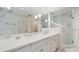 Bathroom featuring a double vanity with a large mirror and a glass-enclosed shower at 2300 N Scenic Hwy # 89, Lake Wales, FL 33898