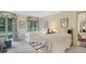 Bright bedroom with two twin beds, floral curtains, and ample natural light at 2300 N Scenic Hwy # 89, Lake Wales, FL 33898