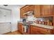 Close-up of the kitchen featuring wood cabinets, granite countertops, and stainless steel range at 2300 N Scenic Hwy # 89, Lake Wales, FL 33898