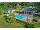 Beautiful kidney shaped pool features lush landscaping and an adjacent guest house at 2300 N Scenic Hwy # 89, Lake Wales, FL 33898