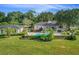 Beautiful kidney shaped pool features lush landscaping and an adjacent guest house at 2300 N Scenic Hwy # 89, Lake Wales, FL 33898