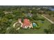 Sprawling estate with red tile roof, landscaped grounds, pool, and winding driveway at 2300 N Scenic Hwy # 61, Lake Wales, FL 33898