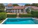 A sparkling swimming pool with a brick paver patio and meticulously maintained hedges at 2300 N Scenic Hwy # 61, Lake Wales, FL 33898