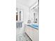 Bathroom featuring a blue sink, white vanity, storage, and decorative starfish rug at 2300 N Scenic Hwy # 61, Lake Wales, FL 33898
