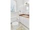 Bathroom with tiled floor, granite countertop, mirror, and white cabinets at 2300 N Scenic Hwy # 61, Lake Wales, FL 33898