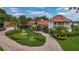 Stunning exterior of a home featuring lush landscaping, a charming fountain, and a paver driveway at 2300 N Scenic Hwy # 61, Lake Wales, FL 33898