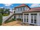 Mediterranean-style home with a staircase leading to a second-story balcony and french doors at 2300 N Scenic Hwy # 61, Lake Wales, FL 33898
