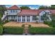 Charming two-story home with red tile roof, brick patio, and lush landscaping at 2300 N Scenic Hwy # 61, Lake Wales, FL 33898