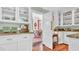 Stylish kitchen showcasing granite countertops, white cabinetry, and open access to the dining area at 2300 N Scenic Hwy # 61, Lake Wales, FL 33898