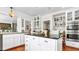 Bright kitchen features white cabinets, stainless steel appliances, granite countertops, and center island with seating at 2300 N Scenic Hwy # 61, Lake Wales, FL 33898