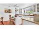 Bright kitchen with a center island, granite countertops, stainless steel refrigerator and ample cabinet space at 2300 N Scenic Hwy # 61, Lake Wales, FL 33898