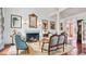 Elegant living room featuring a fireplace, stylish blue furniture, and tasteful artwork at 2300 N Scenic Hwy # 61, Lake Wales, FL 33898