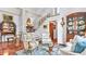 Elegant foyer with staircase, hardwood floors, stylish decor, and an ornate mirror at 2300 N Scenic Hwy # 61, Lake Wales, FL 33898