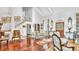 Spacious living room highlighting terra-cotta tile floors, staircase, and charming vintage decor with natural light at 2300 N Scenic Hwy # 61, Lake Wales, FL 33898