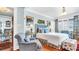Stylish bedroom featuring hardwood floors, elegant furnishings, and ample natural light at 2300 N Scenic Hwy # 61, Lake Wales, FL 33898