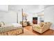 Bright main bedroom with wood floors, sitting area, tv, and access to the outside at 2300 N Scenic Hwy # 61, Lake Wales, FL 33898