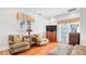 Bright main bedroom featuring a TV, sitting area, and access to a private patio at 2300 N Scenic Hwy # 61, Lake Wales, FL 33898