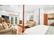 Bright main bedroom with white walls, wood floors, and a view to the outside at 2300 N Scenic Hwy # 61, Lake Wales, FL 33898