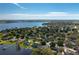 This aerial photo features a view of a community with a lake at 315 Bayberry Dr, Polk City, FL 33868