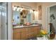 Bathroom featuring double sinks, decorative accents, and ample counter space at 315 Bayberry Dr, Polk City, FL 33868