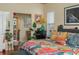 Comfortable bedroom with bright comforter, dresser, and decorative accents at 315 Bayberry Dr, Polk City, FL 33868