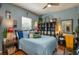 Bedroom with blue walls, decorative accents, and comfortable furnishings at 315 Bayberry Dr, Polk City, FL 33868