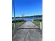 Concrete boat ramp leading to a beautiful lake, ideal for boating and water activities at 315 Bayberry Dr, Polk City, FL 33868