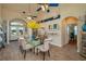 Bright dining room with stylish glass table, comfortable seating, and attractive decor, perfect for Gathering gatherings at 315 Bayberry Dr, Polk City, FL 33868