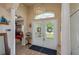 Elegant foyer with a chandelier, arched doorway, and glass double-door entry at 315 Bayberry Dr, Polk City, FL 33868