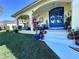 Charming front porch with colorful plants and comfortable seating, creating a welcoming entrance at 315 Bayberry Dr, Polk City, FL 33868