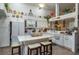 Well-equipped kitchen featuring white cabinetry, modern appliances, a center island, and breakfast bar seating at 315 Bayberry Dr, Polk City, FL 33868