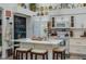 Well-equipped kitchen featuring white cabinetry, modern appliances, a center island, and breakfast bar seating at 315 Bayberry Dr, Polk City, FL 33868