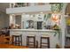 Open-concept living space showcasing a breakfast bar connecting to the kitchen, perfect for entertaining guests at 315 Bayberry Dr, Polk City, FL 33868