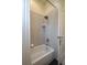A standard white bathtub and shower combination with tiled walls and shower curtain at 315 Bayberry Dr, Polk City, FL 33868