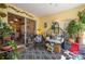Comfortable sunroom featuring cozy seating, colorful decor, and an inviting indoor-outdoor ambiance at 315 Bayberry Dr, Polk City, FL 33868
