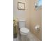Clean and well-maintained toilet with tiled floor and elegant decorations at 315 Bayberry Dr, Polk City, FL 33868