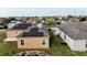 Aerial view of house, highlighting its solar panels on the roof at 318 Gladesdale St, Haines City, FL 33844