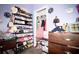 Organized closet and shelving unit featuring shoes, hats, purses, and clothing at 318 Gladesdale St, Haines City, FL 33844