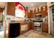 This kitchen features stainless steel appliances, wood cabinets, and great counter space at 318 Gladesdale St, Haines City, FL 33844