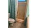 Bathroom featuring a toilet and shower combination at 32 Berna Cir, Winter Haven, FL 33884