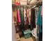 A closet area showcasing ample storage space and organized clothing racks at 32 Berna Cir, Winter Haven, FL 33884