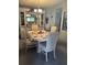 Cozy dining area featuring a lovely table setting and a charming display cabinet at 32 Berna Cir, Winter Haven, FL 33884