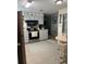 Spacious kitchen with modern appliances, tile flooring, and a breakfast nook at 32 Berna Cir, Winter Haven, FL 33884