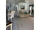 Open-concept living area with a cozy sofa and dining area at 32 Berna Cir, Winter Haven, FL 33884
