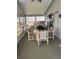 Sunroom with bright windows, carpet, and table and chairs at 32 Berna Cir, Winter Haven, FL 33884