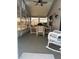 Sunroom with bright windows, carpet, and table and chairs at 32 Berna Cir, Winter Haven, FL 33884