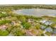 This aerial view with a green pin highlights the property's location in relation to a lake and surrounding neighborhood at 3323 Fox Ridge Dr, Winter Haven, FL 33884