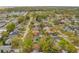 This aerial view with a green pin highlights the property's location within a neighborhood surrounded by mature trees at 3323 Fox Ridge Dr, Winter Haven, FL 33884