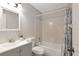 Cozy bathroom featuring tub and shower combo with updated vanity at 3323 Fox Ridge Dr, Winter Haven, FL 33884